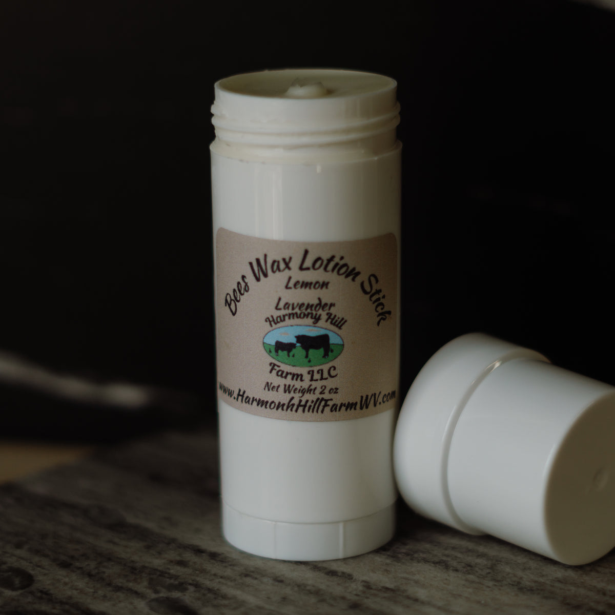 White lotion stick with a label on a dark background